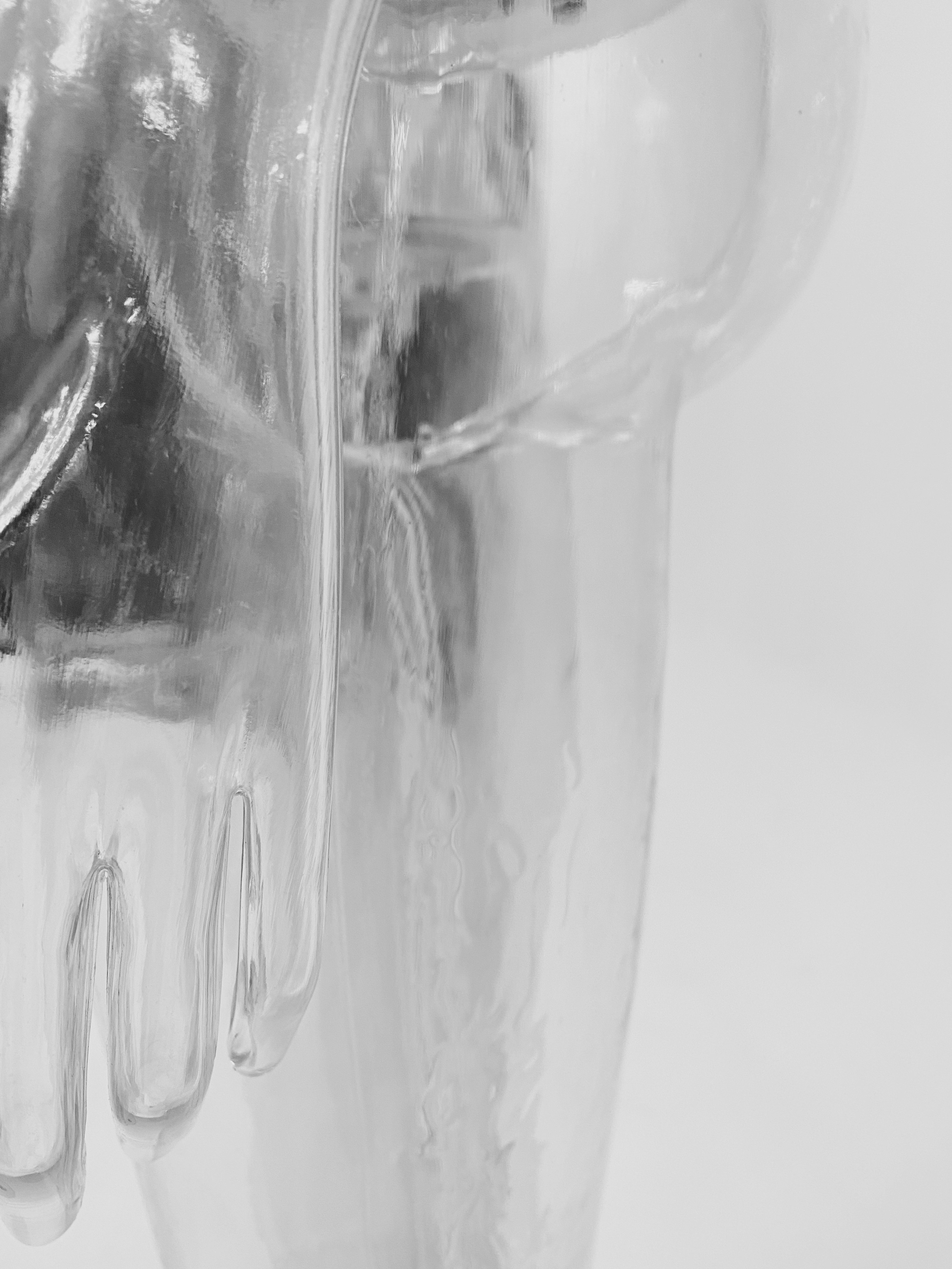 clear glass pitcher on white table